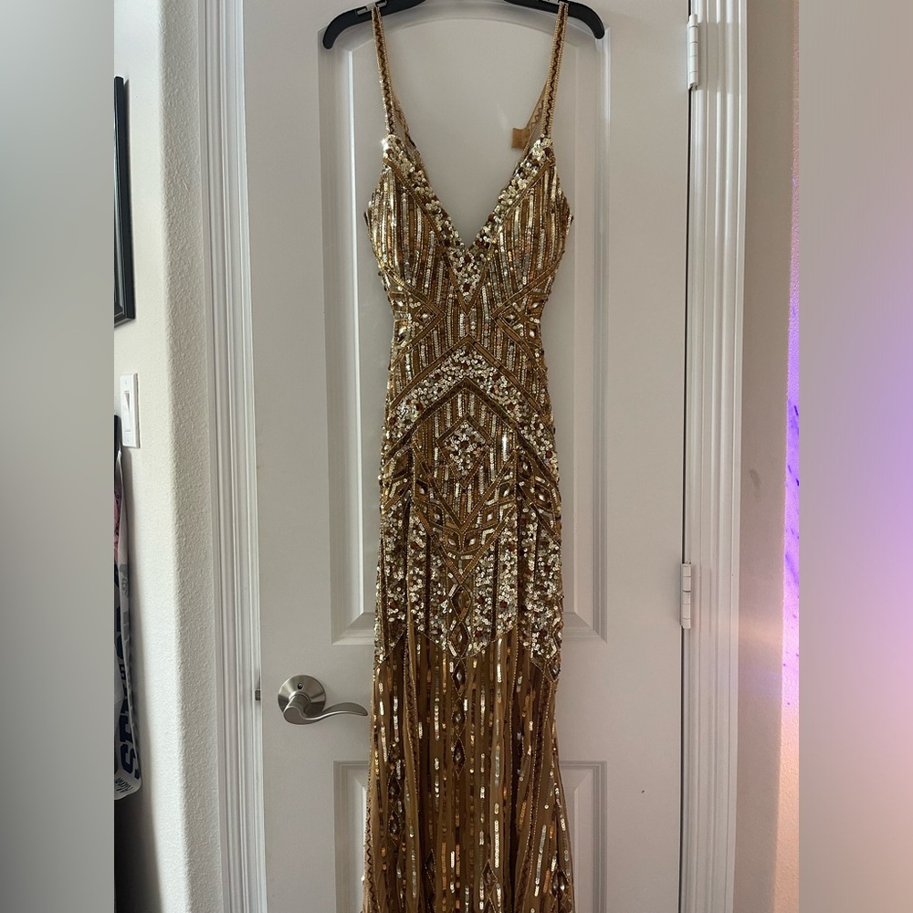 Brand new never been worn Paul Rekhi gold dress 
-Size 6